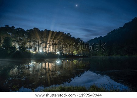 Pang Ung is a large reservoir on the top of a hill. It is a romantic top. Of Mae Hong Son A photo of a sun-rays reflecting the waters. Mixed fog fog.