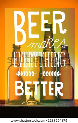 bottles and glass of beer with foam on surface on orange background with "beer makes everything better" inspiration