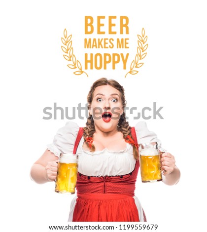 shocked oktoberfest waitress in traditional bavarian dress with mugs of light beer isolated on white background with "beer makes me hoppy" lettering