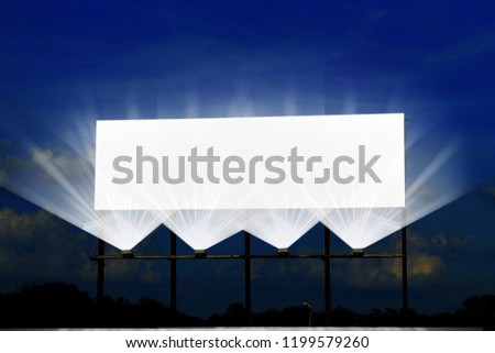 billboard or advertising board  with flood light on dark night sky with cloud for advertising,business,marketing,commercial related concept