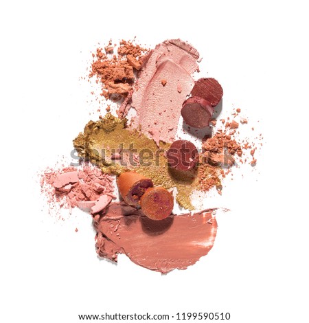 Creative concept photo of cosmetics swatches beauty products lipstick eyeshadow on white background.