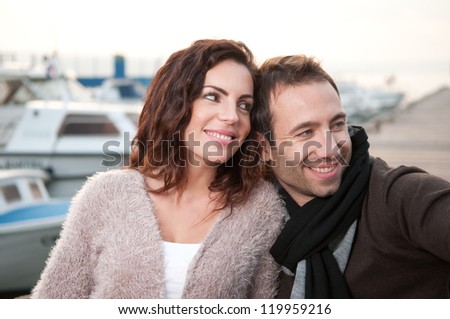 Relaxed couple on wooden pier
