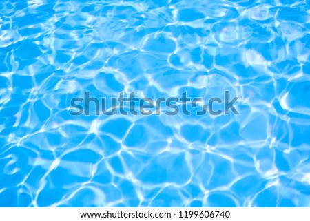 Ripple water in swimming pool sun reflection