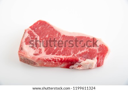 top loin new york strip steak bone in Royalty-Free Stock Photo #1199611324