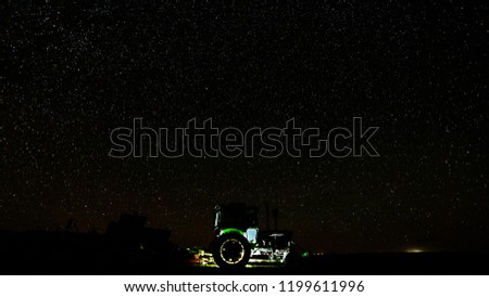 Tractor Glowing in Night Scape