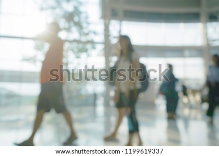 Abstract Blurred Background Crowd of people walking in modern building                              