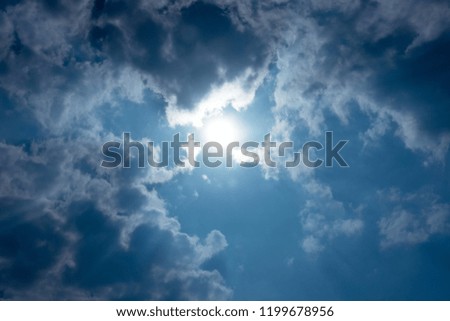 Sunshine and clouds with a blue,  White sunlight rays on cloudy sky.