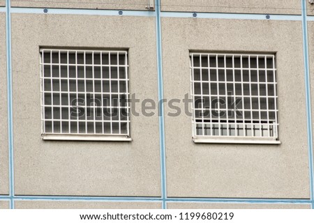 Modern prison windows with metal bars Royalty-Free Stock Photo #1199680219