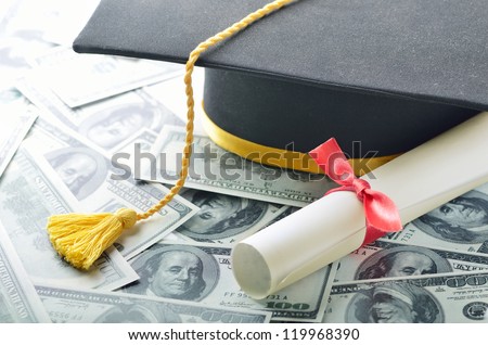 Graduation hat with diploma and money Royalty-Free Stock Photo #119968390