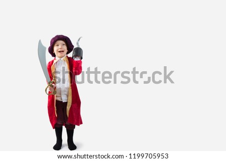 Happy boy dressed in a pirate Halloween Costume