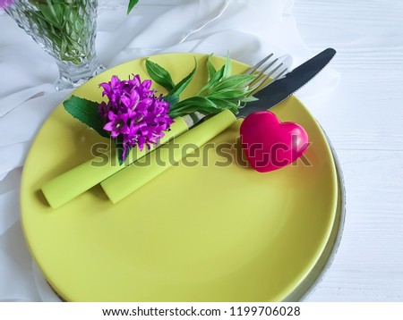 plate fork knife heart flower chrysanthemum on wooden background