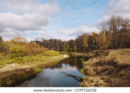 autumn landscape with forest river