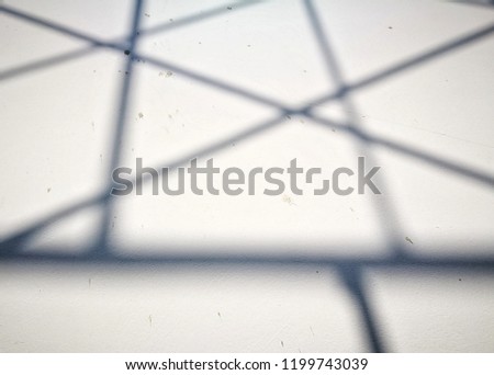shadow graphic on concrete wall, abstract texture on cement surface background, minimal shadow line detail, blurred of shadow line pattern on the floors