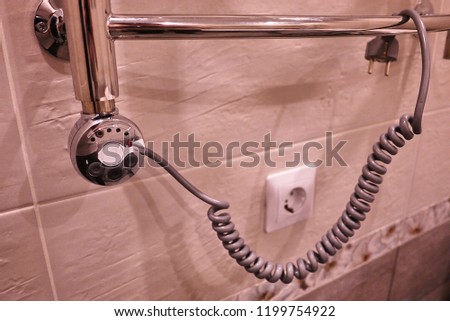 Electric heated towel rail to bathroom