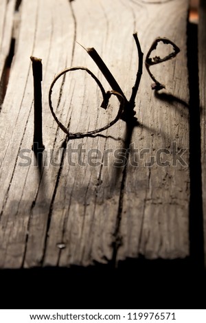 Word ''love'' on a old wood planks. Happy Valentines day card.