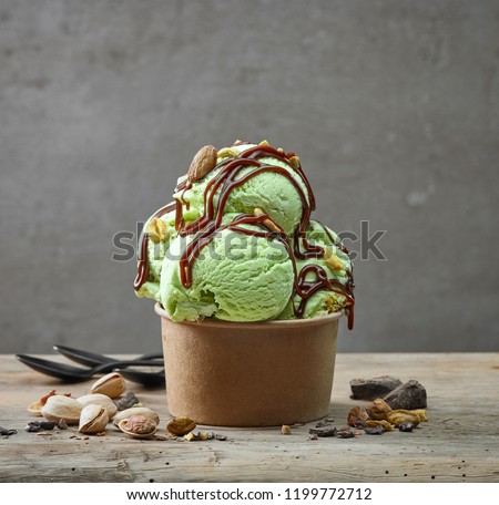 paper cup of pistachio ice cream