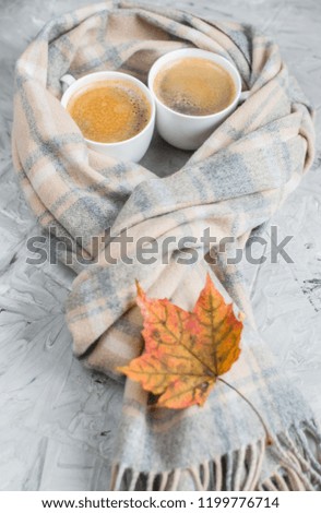 Tea Cup with Coffee Hot Chocolate Autumn Time Bakery Pretzel Toned Photo Knitting Scarf Blanket Yellow Leaves Gray Background