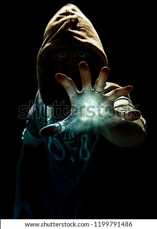 Wizard making spell with six finger's hand, photo manipulation  Royalty-Free Stock Photo #1199791486