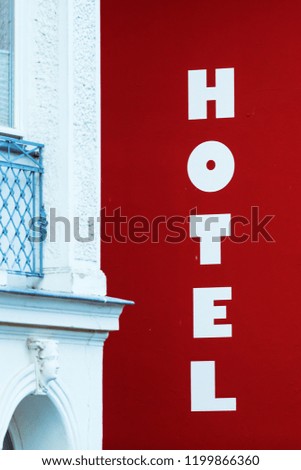 picture of a hotel sign at the facade of a hotel