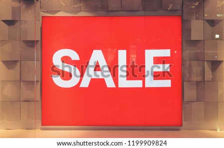 The price tag is written as "SALE” red background in glass cabinet.