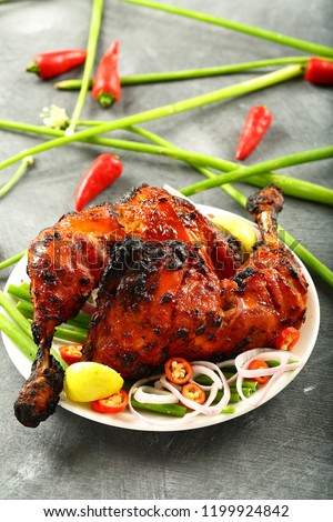 Healthy marinated grilled chicken meat with fresh salads.