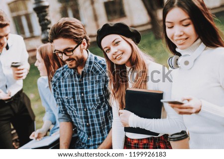 Notebooks. Friendship. Girl. Look. Camera. Sit. Courtyard. University. Students. Architecture. Freelance. Hipster. Group of Young People. Study Together. Good Mood. Laptop. Textbooks. Have Fun.