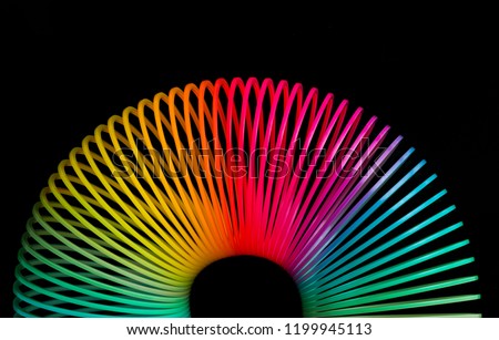 Classical slinky spring toy isolated on the white background
