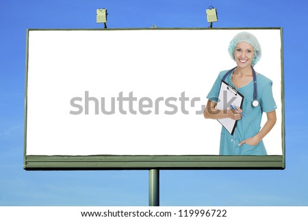 Pretty doctor smiling to you from billboard with a space for your info