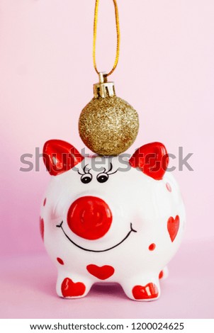 Piggy bank over pink background. Year of pig 2019.