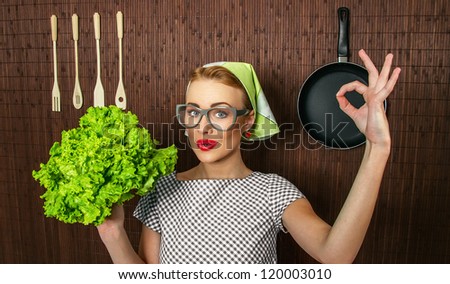 Happy woman cook with okay sign holding salad, close up