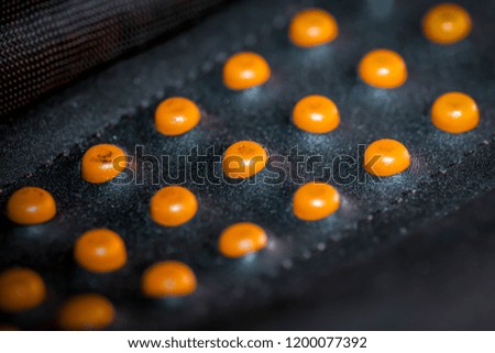 abstract yellow pimples on black background
