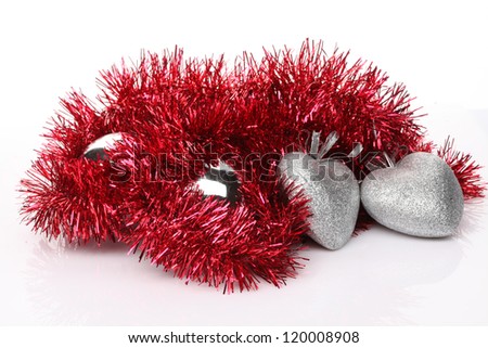 christmas balls and hearts on white background