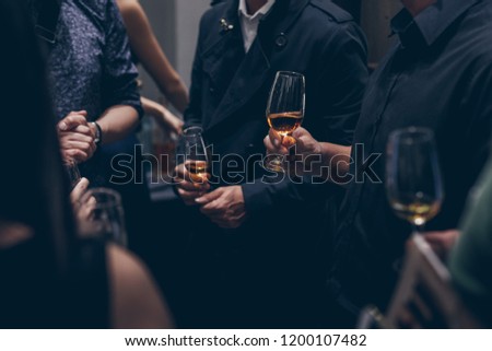 Close up shot group of people in corporate business dinner event with food and champagne