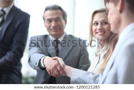 close up.image of business partners handshaking in the office