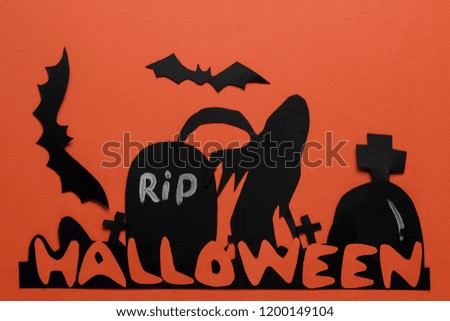 Halloween holiday. Composition with different halloween paper figures. view from above. on orange background
