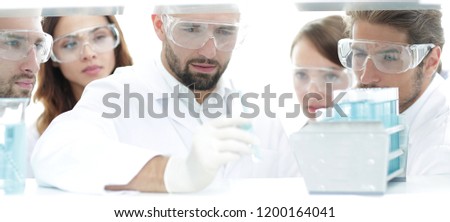 closeup of a group of scientists and pharmacists in the laboratory.