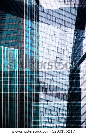 Modern glass architecture. Collage photo of high-rise office buildings / skyscrapers with structural glazing at different times of day.