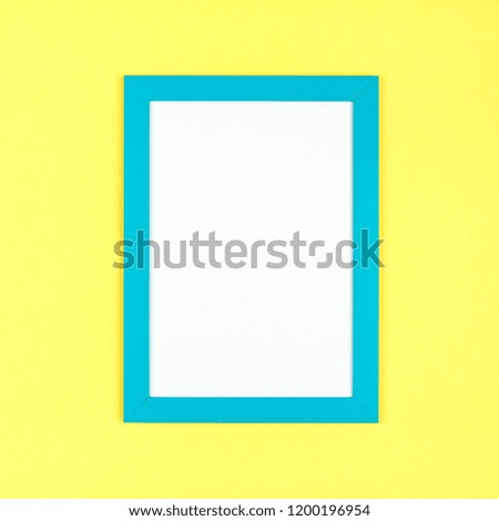 Flat lay pastel colored textured minimalist background with empty picture frame mockup