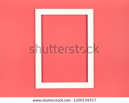 Abstract blank picture frame flat lay on textured pastel colored paper background. Minimalist picture frame mockup