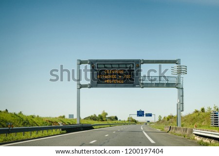 French highway with security message on the information live display - tied belt, life saved - safety signage