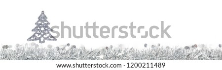 Christmas silver grey garland and silver trees decoration photo on white background. Banner panoramic