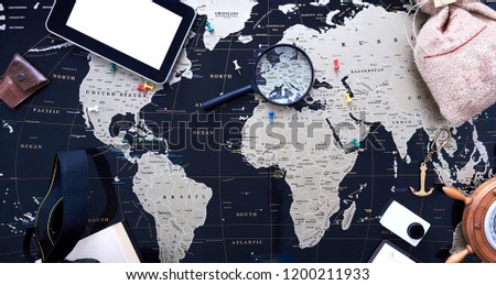 Black political map of the world. Still life of a traveler.
