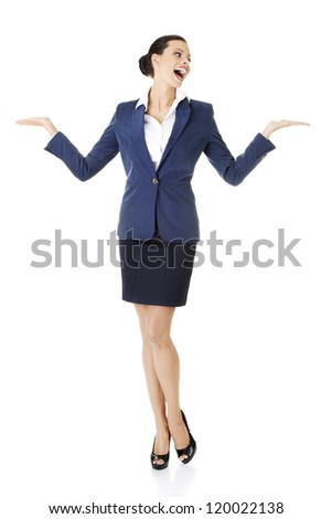 Happy young business woman showing copy space, isolated on white