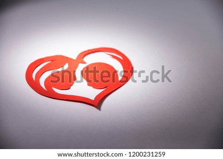 mother and child in the form of hearts from paper