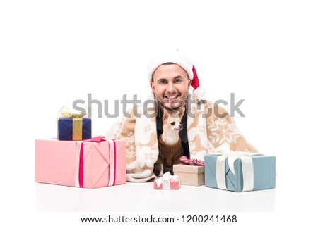happy man in santa claus hat with chihuahua dog and christmas gifts isolated on white
