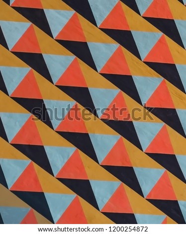 View of the wall, the background of multi-colored triangles. Royalty-Free Stock Photo #1200254872