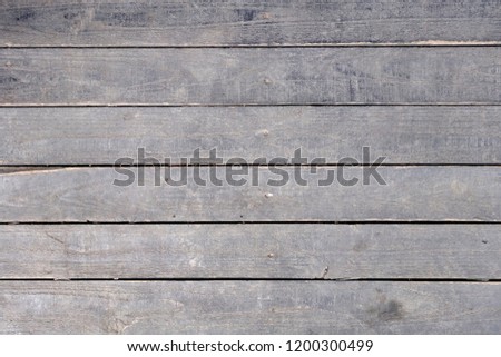 old weathered rustic black wooden plank floor or wall texture background, rough surface of grunge wood decking panel, flat lay close up top view Royalty-Free Stock Photo #1200300499