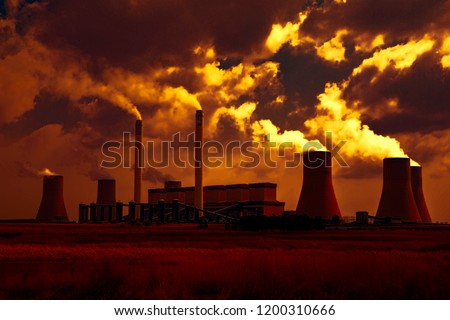 Power station in the golden glow of sunset.  South Africa and pollution  Royalty-Free Stock Photo #1200310666