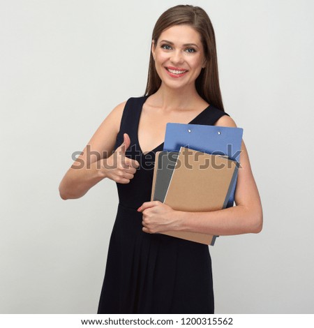 Woman teacher holding book and notebook show thumb up. 