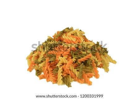 Pile of Uncooked Fusilli or Three-color Spiral Shaped Pasta Isolated on White Background with Free Space for Text or Design